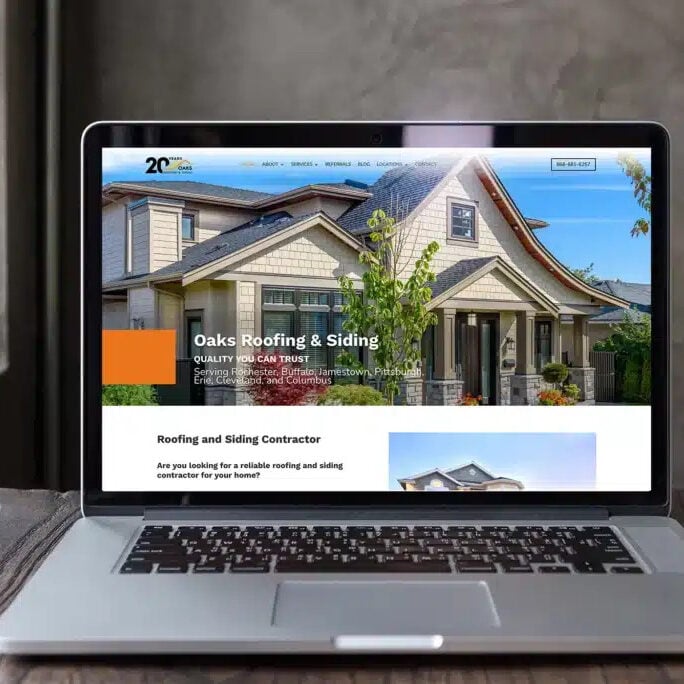 A laptop screen showing a serene mountain landscape. The image is pixelated and unclear.